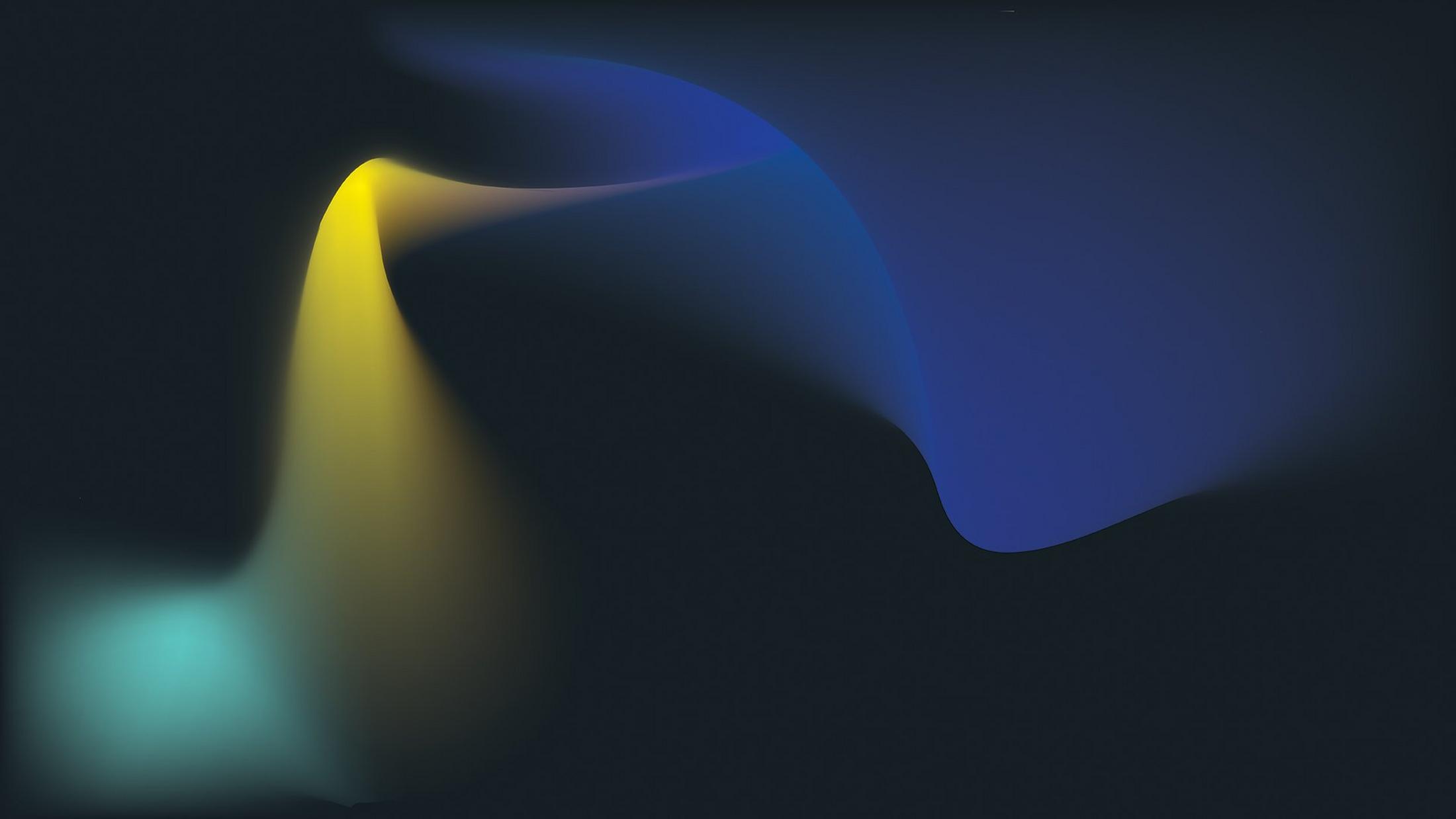 une image floue d’une vague jaune et bleue